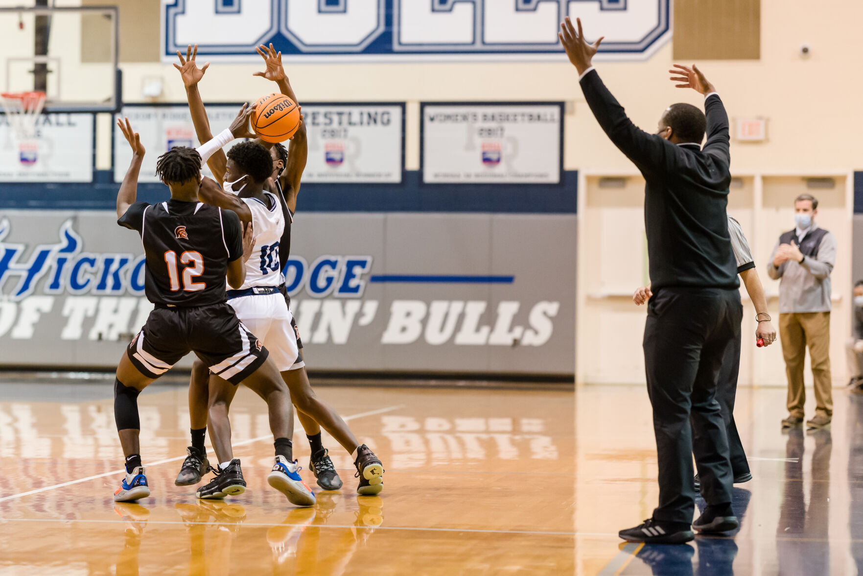 Boys Basketball: Hickory Ridge RaginÕ Bulls defeated the Northwest Cabarrus Trojans 64-56.